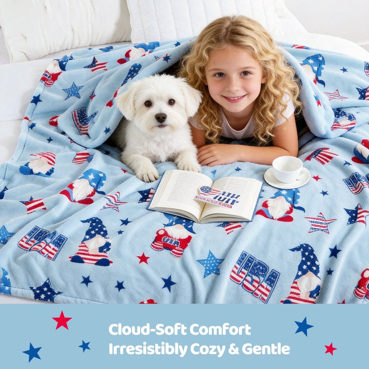 Child and dog under a patriotic-themed blanket with a book and cup on a bed.#color_Misty Blue