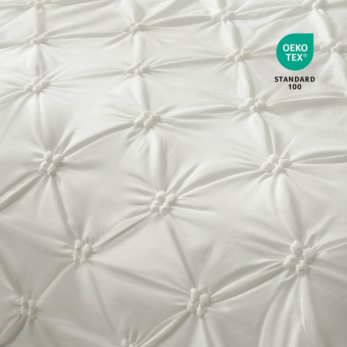 Close-up of Cozy Bliss OEKO-TEX Standard 100 Certified fabric and pintuck design.#color_Off White