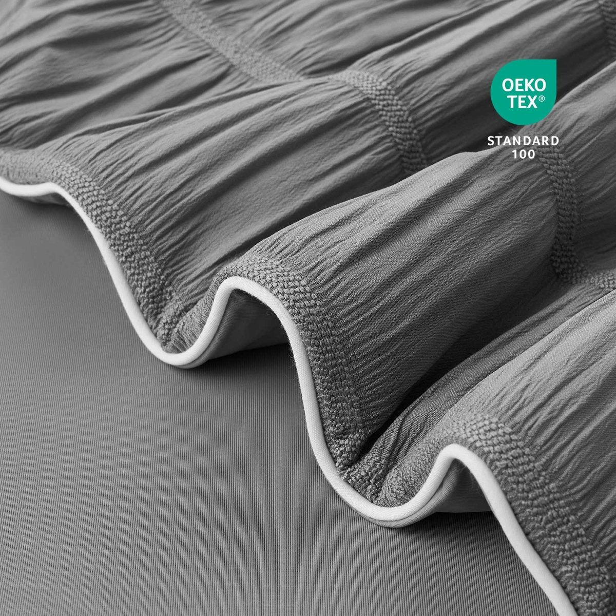 Close-up of OEKO-TEX Standard 100 certified fabric.#color_Charcoal Grey