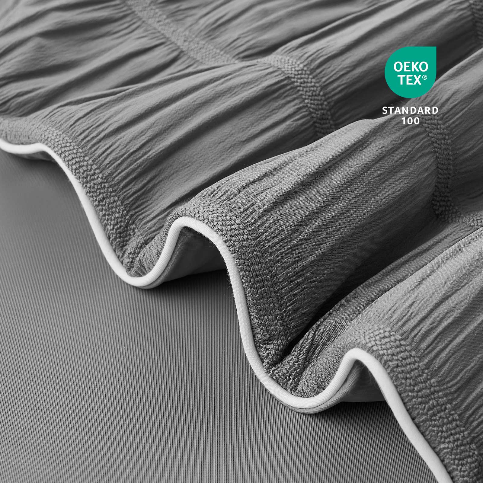 Close-up of OEKO-TEX Standard 100 certified fabric.#color_Charcoal Grey