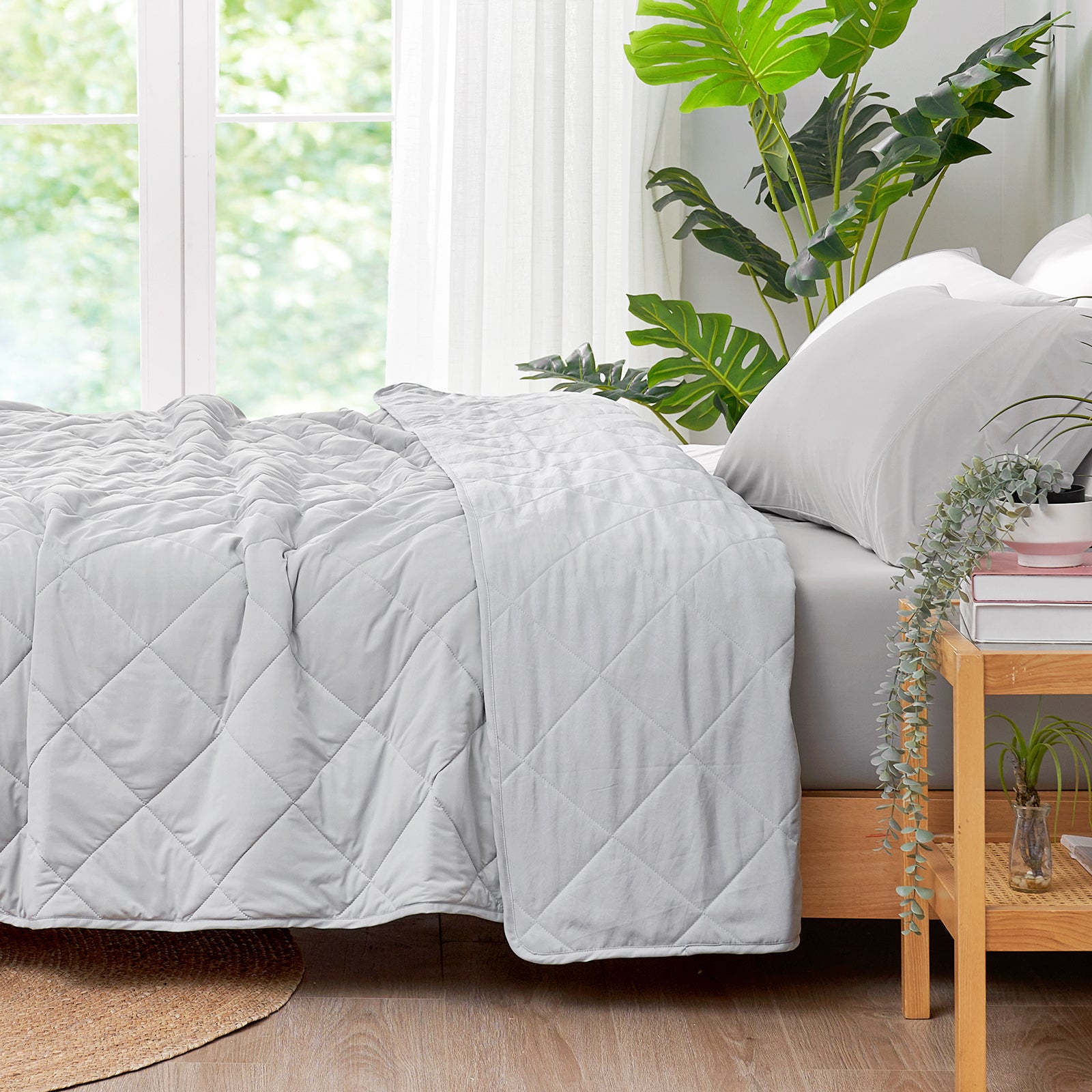 Cozy Bliss Chill Weave Square Cooling Blanket in a bedroom setting #Color_Cool Grey