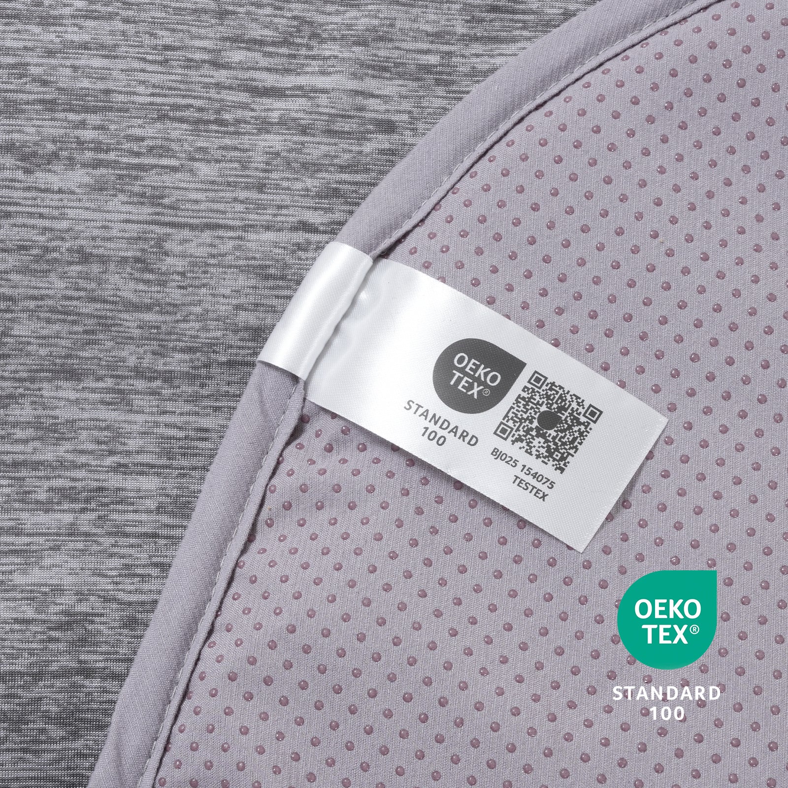 Oeko-Tex label on gray paw-shaped cooling pet mat fabric.#color_Charcoal Grey
