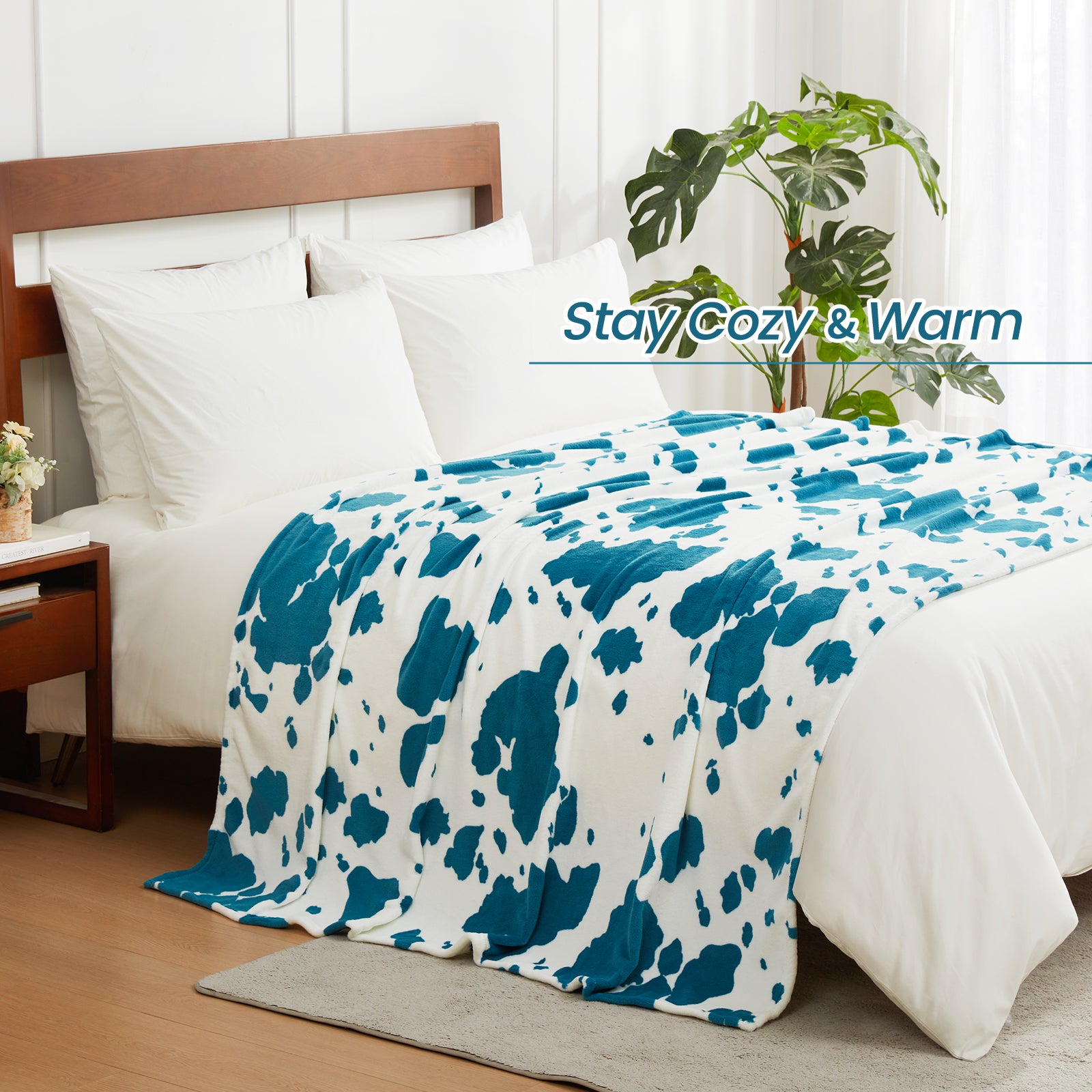 Blue and white patterned blanket on a bed with 'Stay Cozy & Warm' text. #color_Blue
