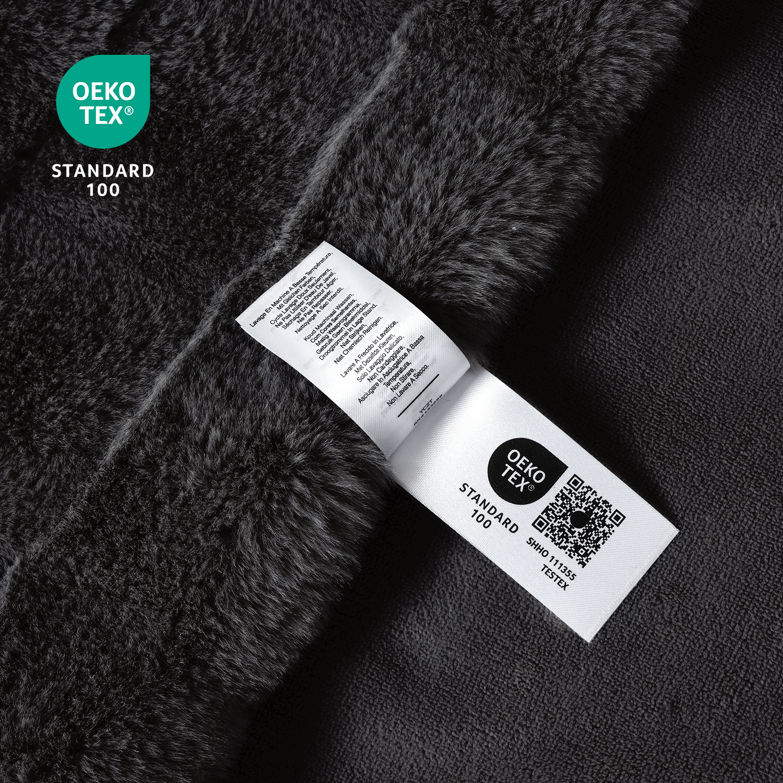 Close-up of OEKO-TEX certified cross-striped faux fur black blanket fabric. #Color_Black