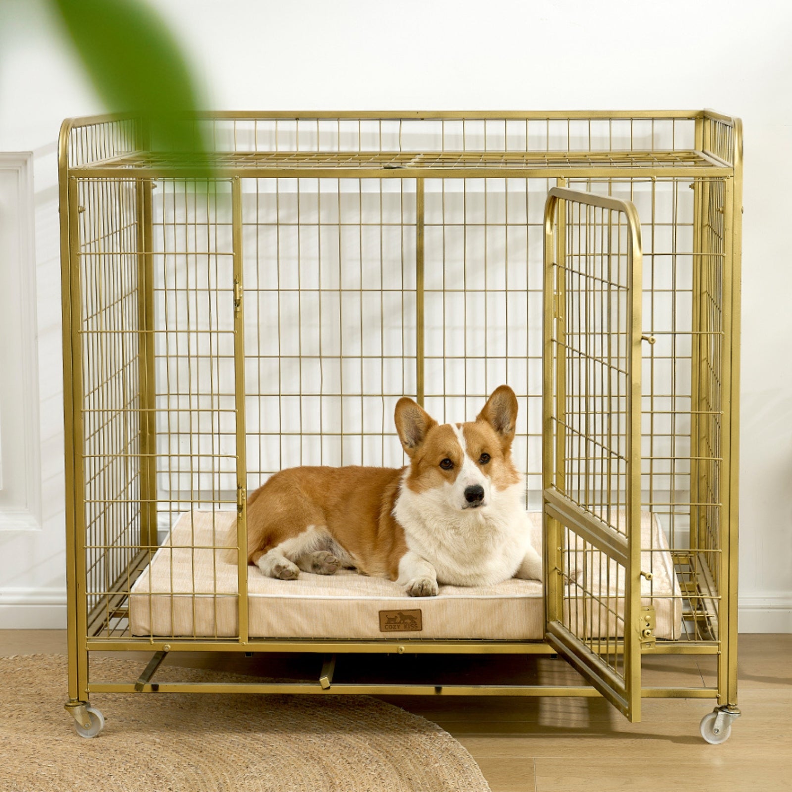 Dog lying on a cooling cushion inside a gold metal dog crate.#color_Beige