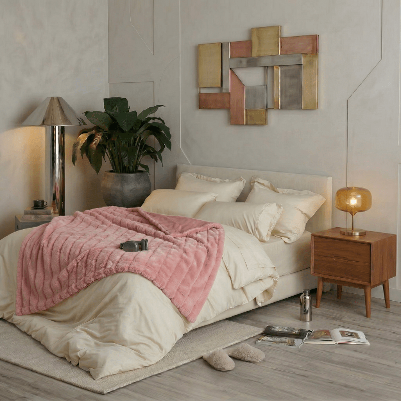 Cozy Bliss faux fur blanket styled on a modern bed, creating a soft and cozy bedroom atmosphere #color_Pink