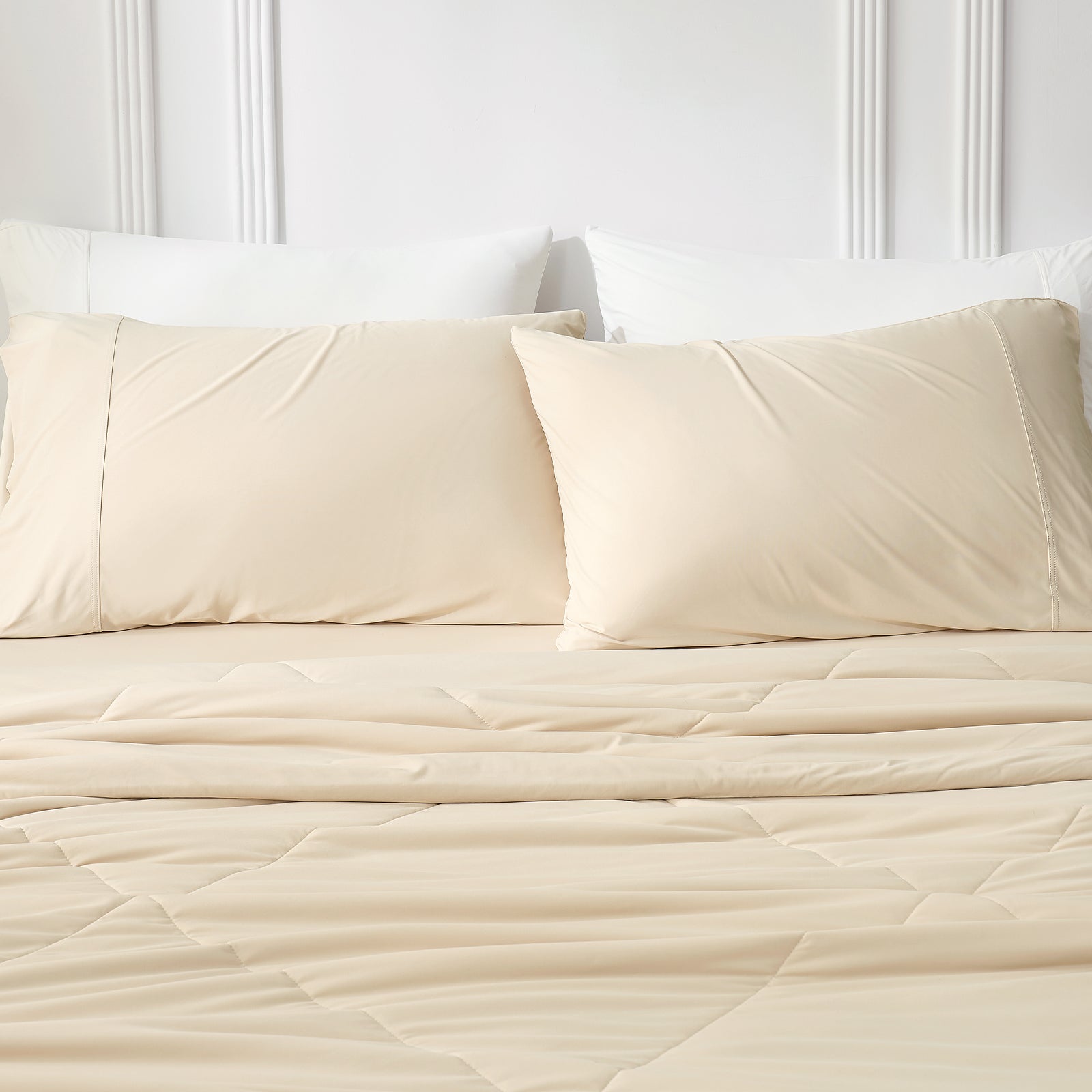 Khaki cooling pillowcases on bed with cozy comforter.#color_Khaki