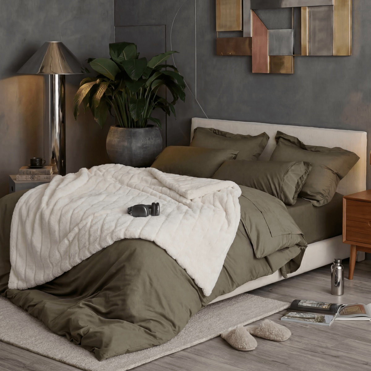 Cozy Bliss sheared faux fur throw blanket layered across the bed in a soft neutral room display #color_Ivory