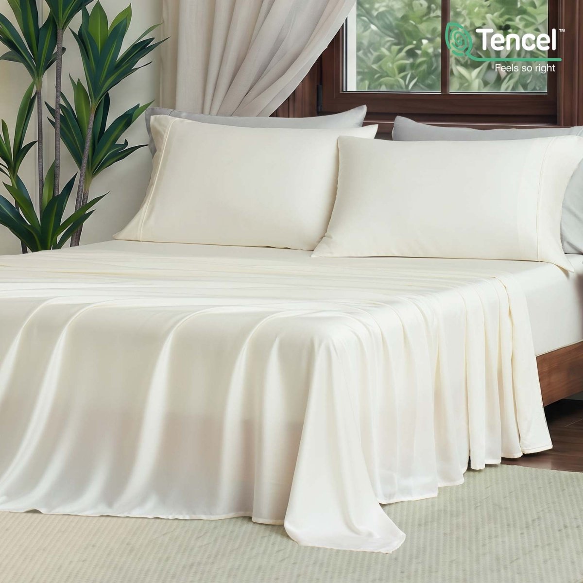Front view of Cozy Bliss Tencel™ Eco-friendly Silky Sheet Set on a bed, showcasing smooth drape and elegant bedding style. #color_Cream White