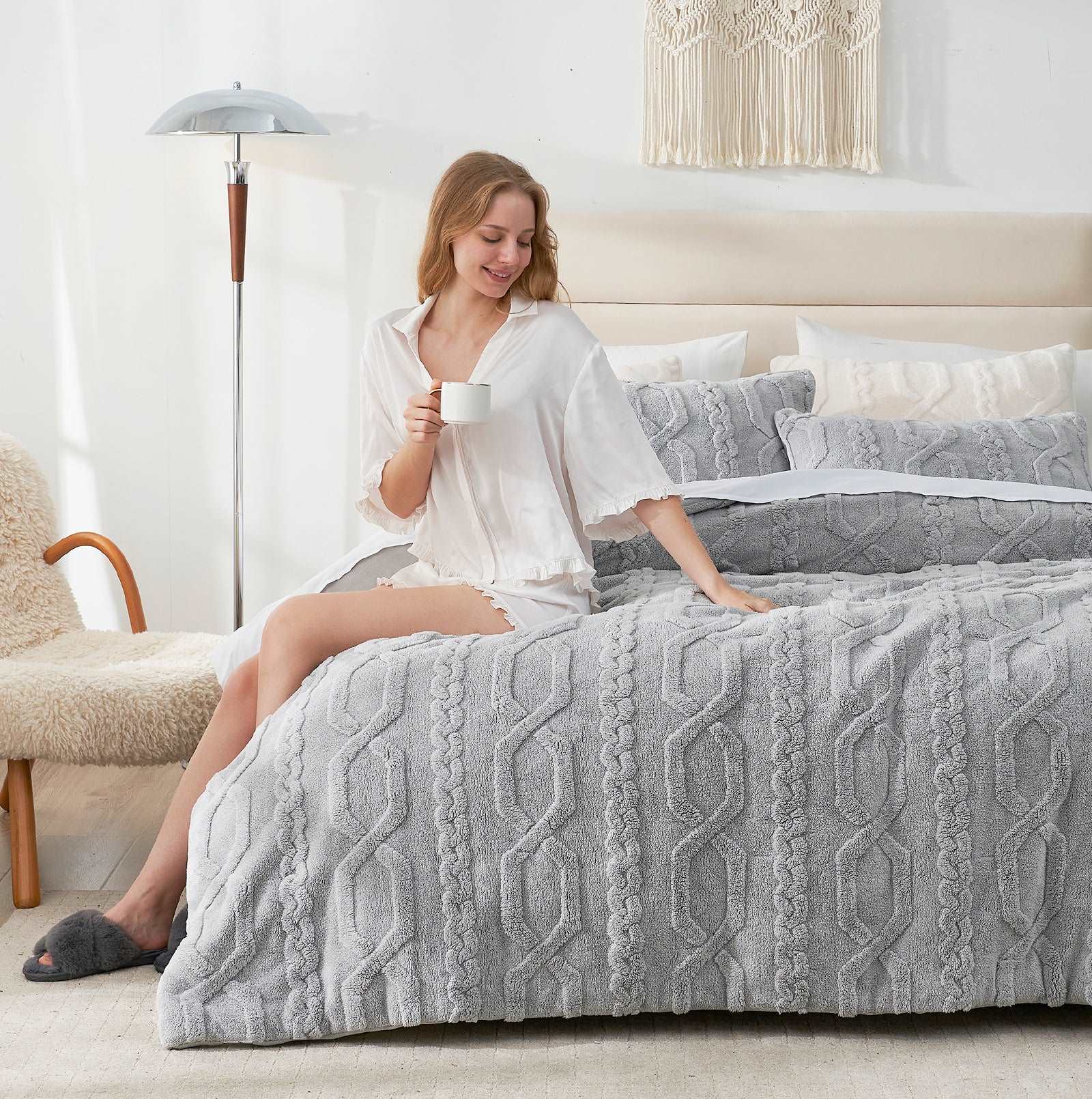 Woman on cozy bed with gray sherpa comforter set #color_Light Grey