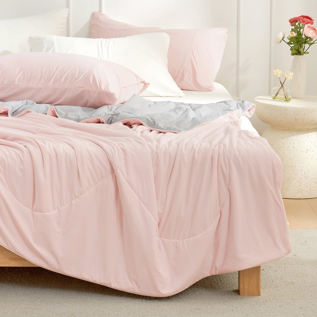 Pink and grey Cozy Bliss cooling comforter on bed, soft breathable dual-tone reversible bedding. #Color_Pink/Grey