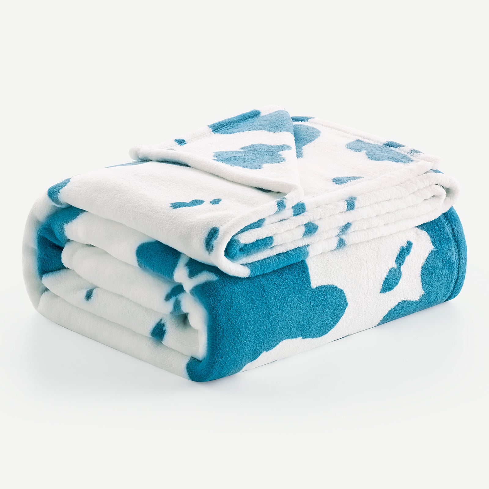 Folded blue and white patterned blanket on a white background #color_Blue