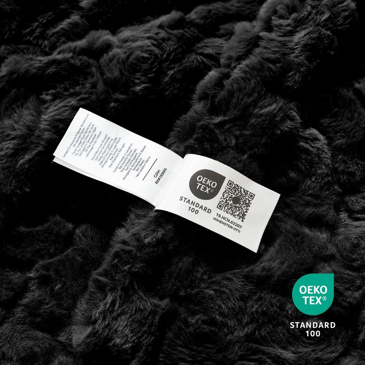 OEKO-TEX STANDARD 100 certified faux fur blanket texture close-up #color_Black