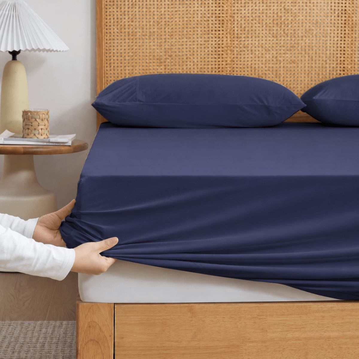 Cozy Bliss Blue-colored cooling fitted sheet set with pillowcases front view. #Color_Navy Blue
