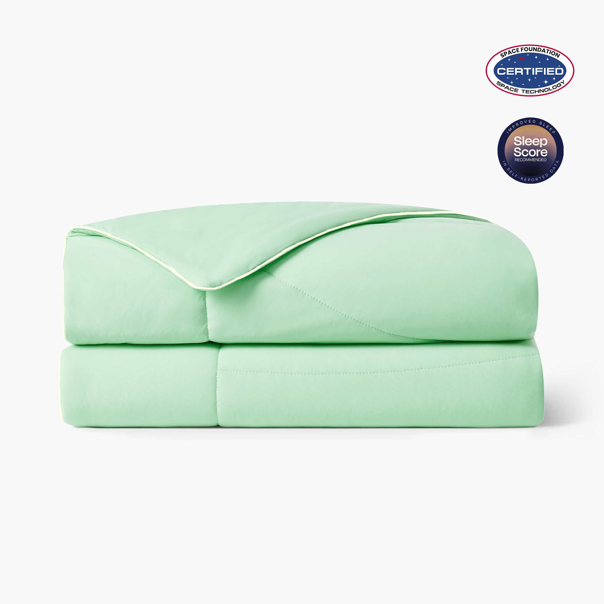 Folded mint macaron cooling comforter with Space Foundation and Sleep Score certification logo on a white background#color_Mint Macaron