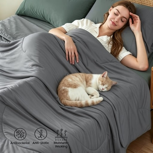 Woman lying in bed with a cat under a gray blanket, with product features displayed.#color_Dark Grey